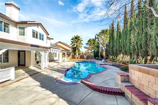 view of pool featuring a patio