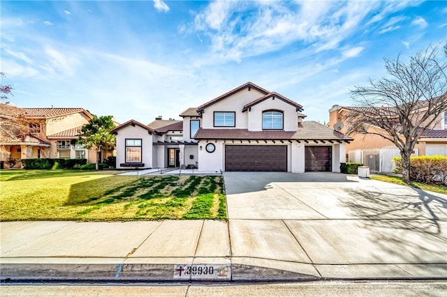 view of front of property featuring a garage and a front lawn