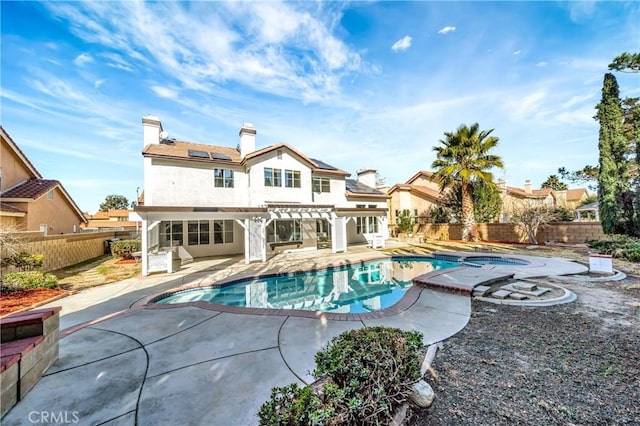 view of pool with an in ground hot tub, a pergola, and a patio area