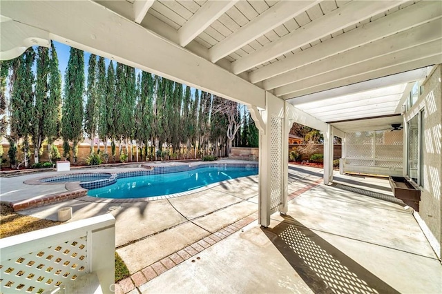 view of swimming pool with an in ground hot tub and a patio