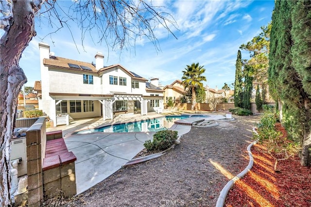 view of swimming pool featuring a pergola, a patio area, and an in ground hot tub