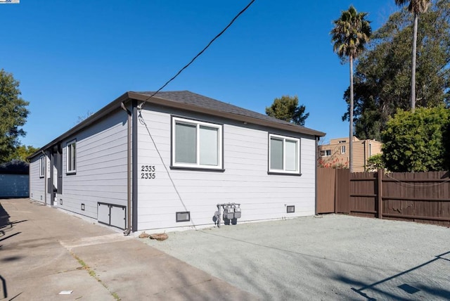 view of side of property with a patio area