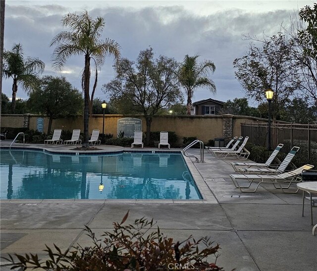 view of swimming pool with a patio area