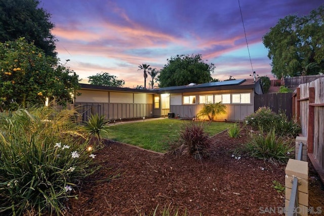 view of yard at dusk