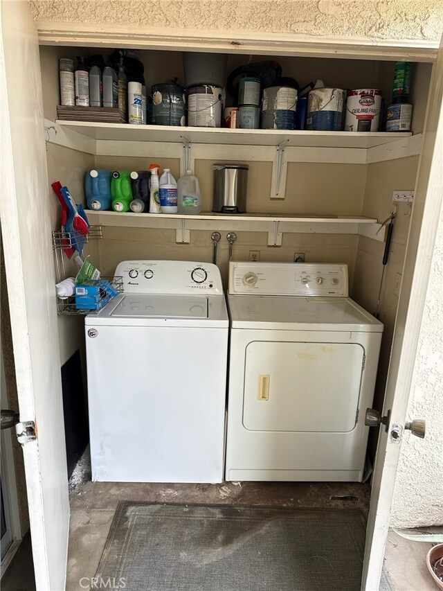 clothes washing area featuring washing machine and clothes dryer