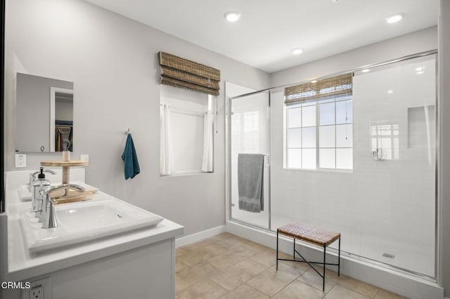 bathroom with tile patterned flooring, vanity, and an enclosed shower