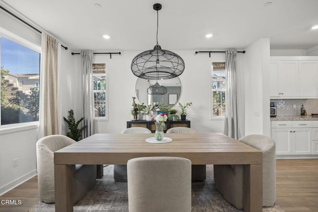 dining area featuring dark hardwood / wood-style floors