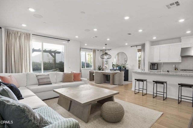 living room with light hardwood / wood-style flooring