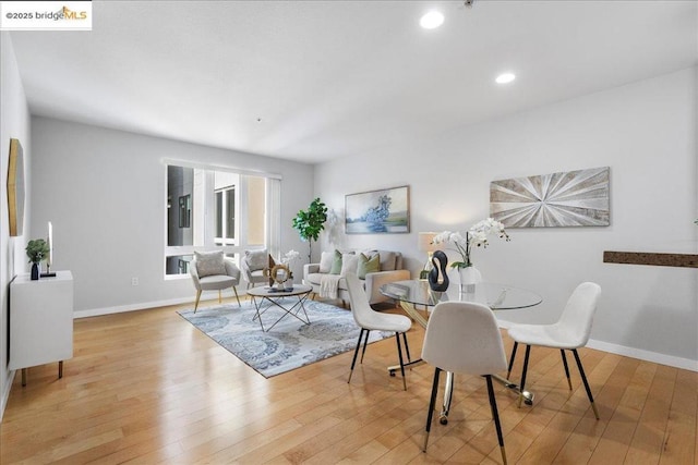 dining area with light hardwood / wood-style flooring