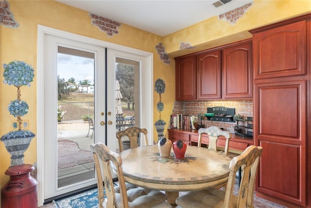 dining space featuring french doors