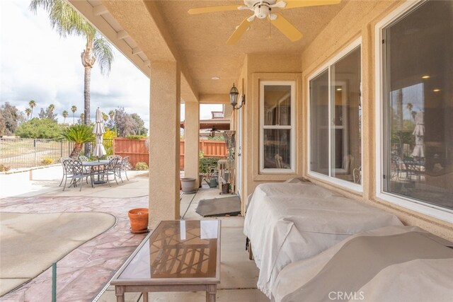 view of patio / terrace featuring ceiling fan