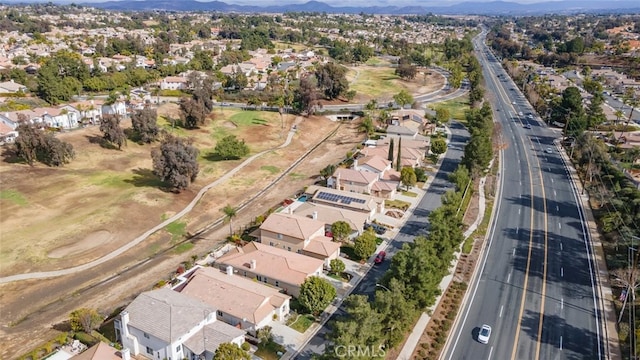 birds eye view of property with a mountain view