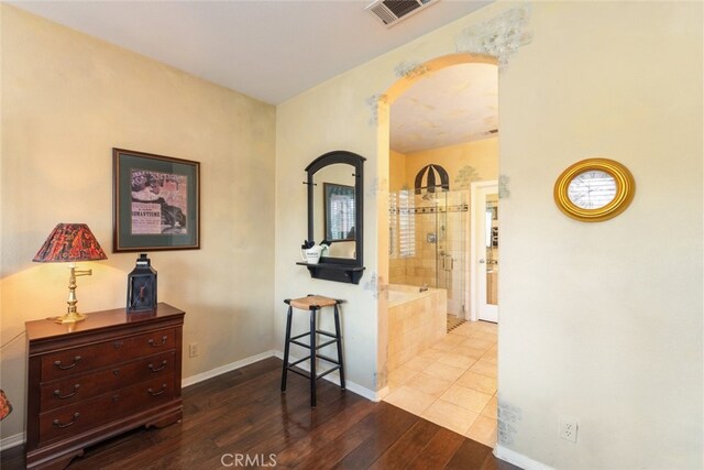 corridor featuring hardwood / wood-style floors