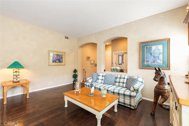 living room featuring dark wood-type flooring