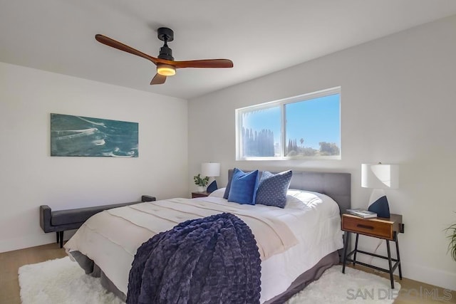 bedroom featuring light hardwood / wood-style floors and ceiling fan