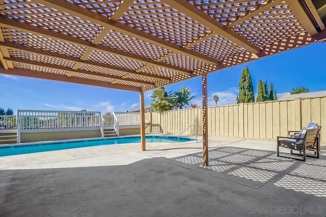 view of patio with a fenced in pool and a pergola