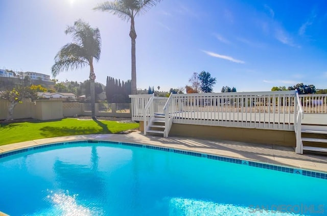 view of swimming pool featuring a deck