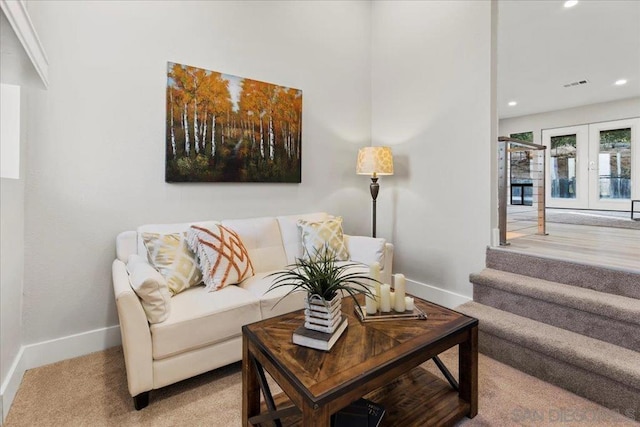 living room with french doors and carpet flooring