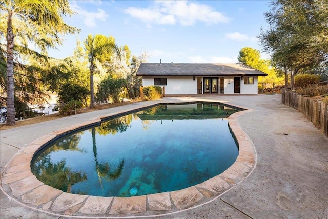 view of swimming pool with a patio area