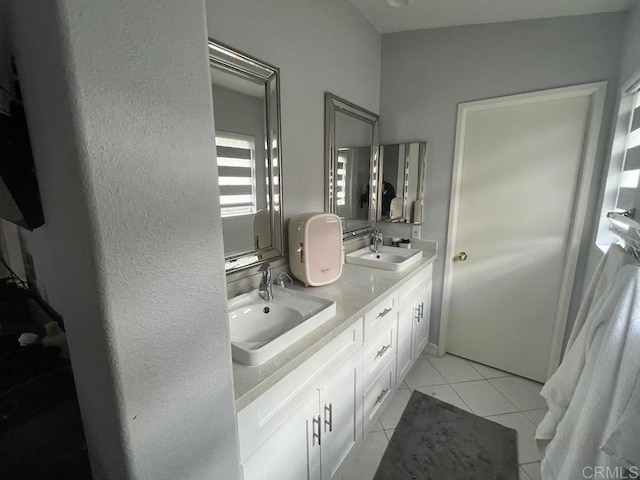 bathroom with tile patterned flooring and vanity