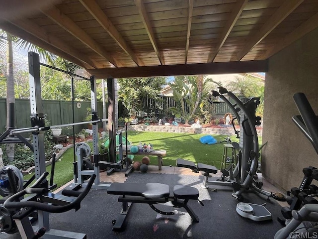 gym featuring lofted ceiling and wood ceiling