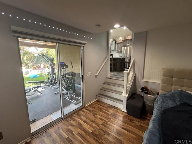 entryway with dark hardwood / wood-style flooring