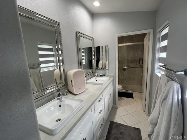 bathroom featuring lofted ceiling, toilet, an enclosed shower, vanity, and tile patterned flooring