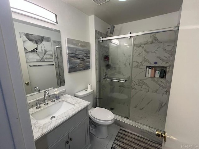 bathroom featuring walk in shower, vanity, and toilet