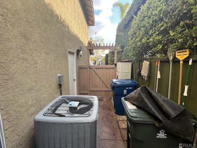 view of side of property featuring central air condition unit