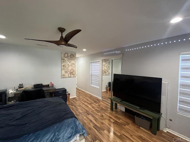 bedroom featuring hardwood / wood-style flooring and ceiling fan