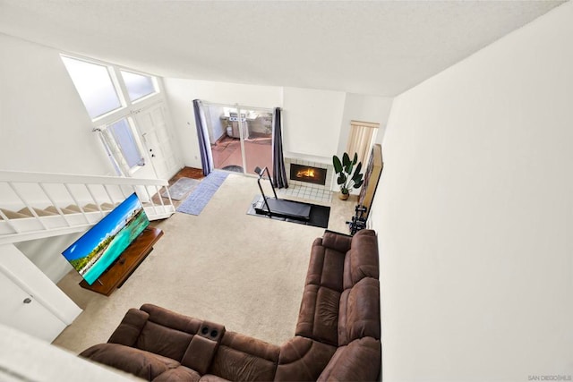 living room featuring a tiled fireplace