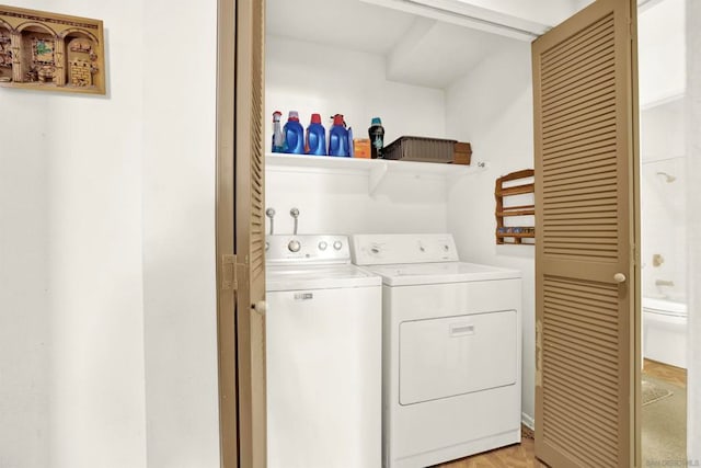 clothes washing area featuring washing machine and clothes dryer