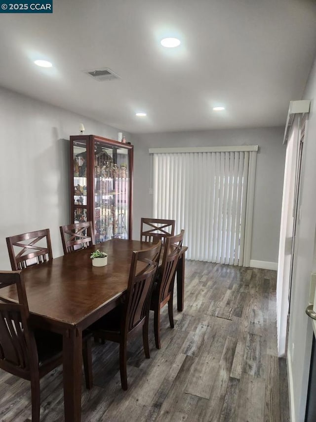 dining area with wood-type flooring