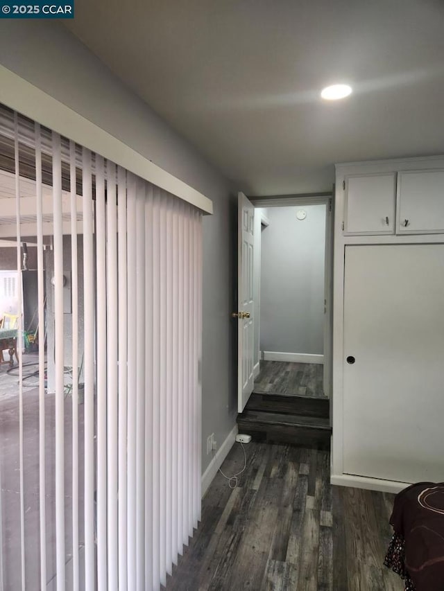 interior space with dark hardwood / wood-style flooring