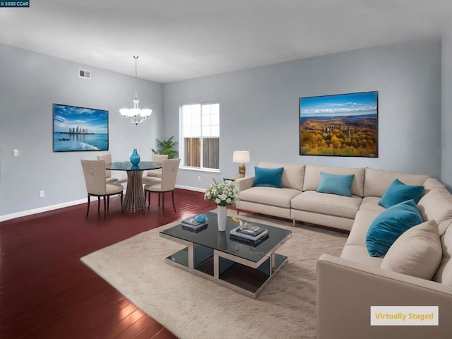 living room featuring hardwood / wood-style floors and a chandelier