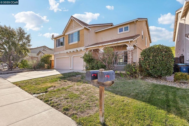 view of front of home with a garage and a front lawn