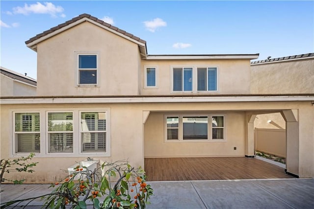 rear view of house with a patio