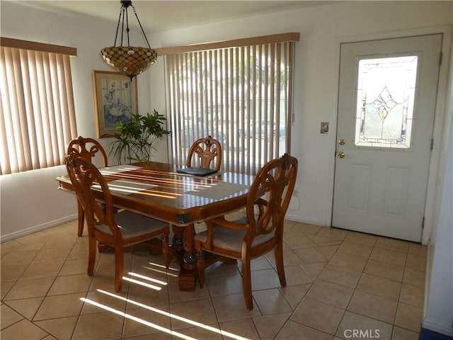 dining space featuring tile patterned flooring