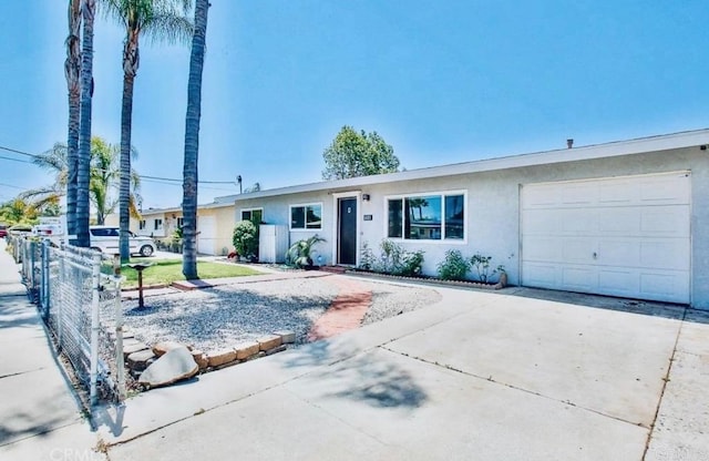 ranch-style house featuring a garage