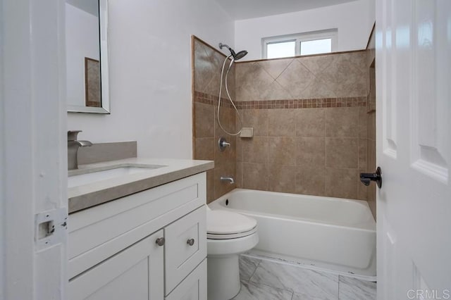 bathroom with marble finish floor, shower / bathing tub combination, vanity, and toilet