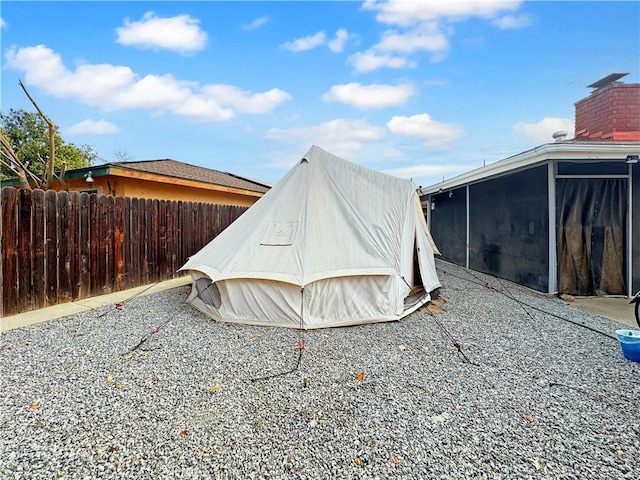 view of yard featuring a patio area and a sunroom