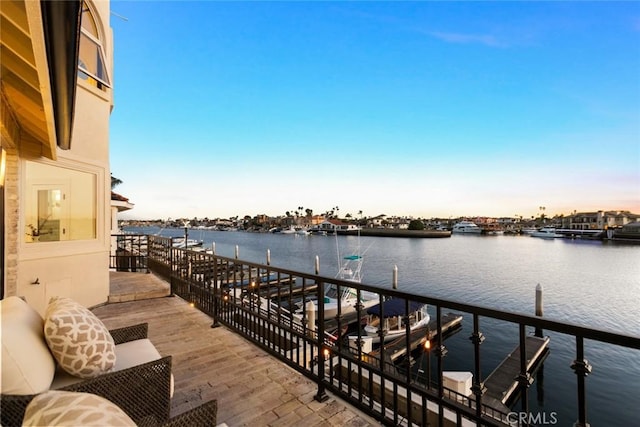 balcony at dusk with a water view