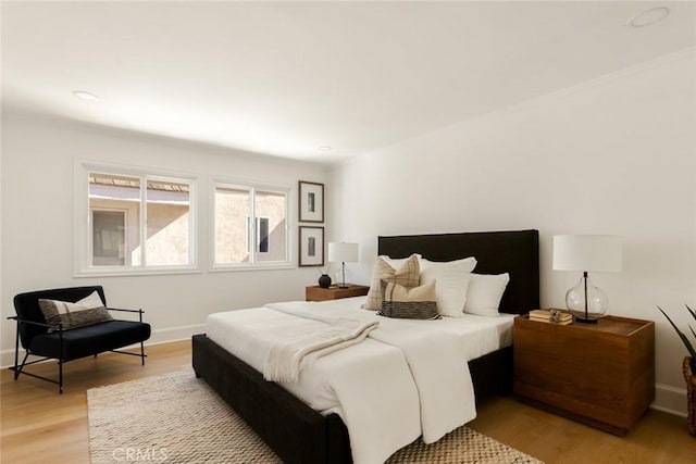 bedroom featuring light hardwood / wood-style floors