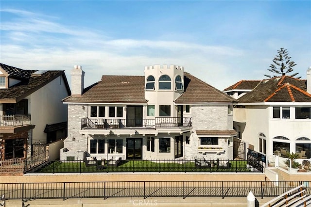 back of house with a balcony