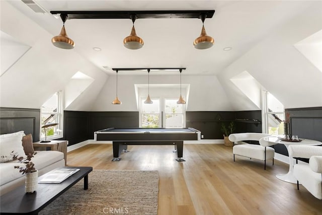 playroom with vaulted ceiling, plenty of natural light, pool table, and light wood-type flooring