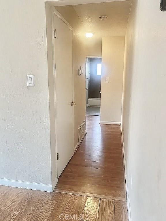 corridor featuring light hardwood / wood-style flooring