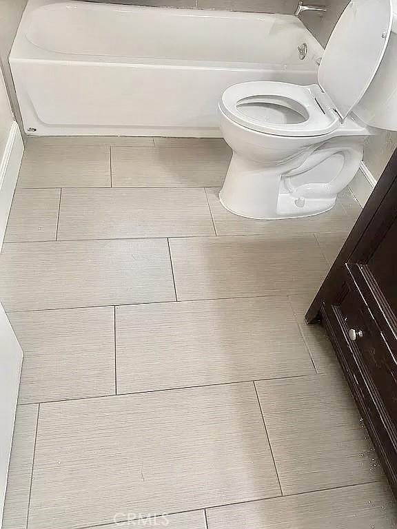 bathroom featuring toilet