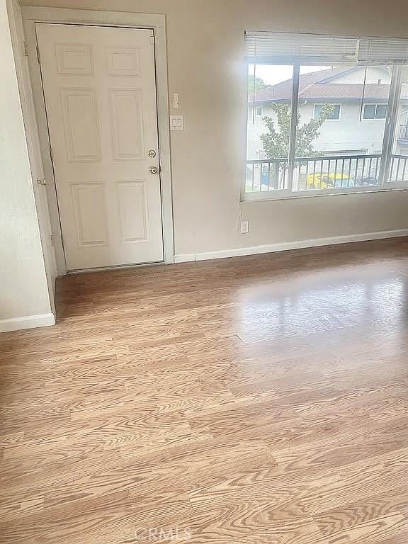 empty room with light hardwood / wood-style floors