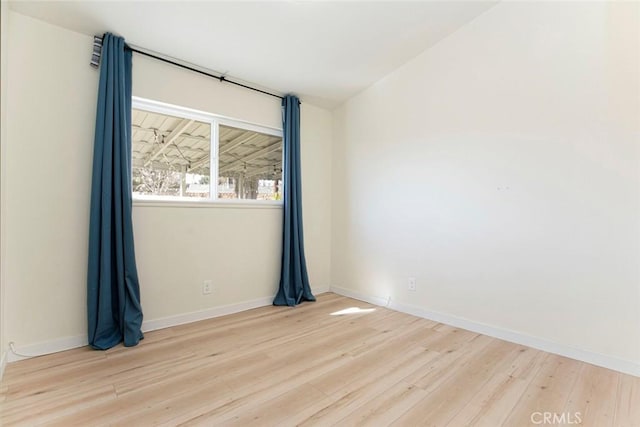 unfurnished room with light hardwood / wood-style floors