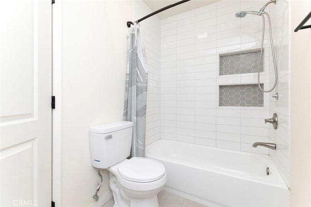 bathroom featuring shower / bath combo and toilet